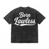 Black vintage-wash t-shirt with 'Born Lawless' cracked white lettering on back