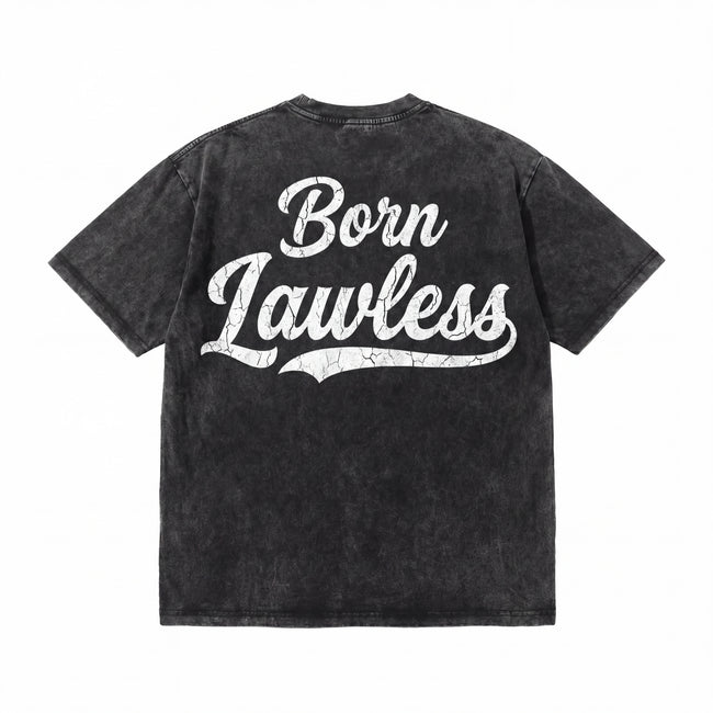 Black vintage-wash t-shirt with 'Born Lawless' cracked white lettering on back Hover Image