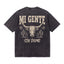 Black t-shirt with 'Mi Gente Sin Domo' text, steer skull, cacti, and star graphics on back