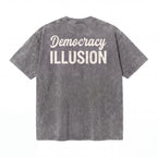 Washed black t-shirt with white 'Democracy ILLUSION' text on the back