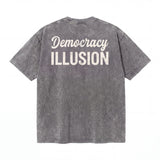 Washed black t-shirt with white 'Democracy ILLUSION' text on the back