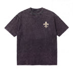 Black acid wash t-shirt with fleur-de-lis emblem on chest, casual streetwear style