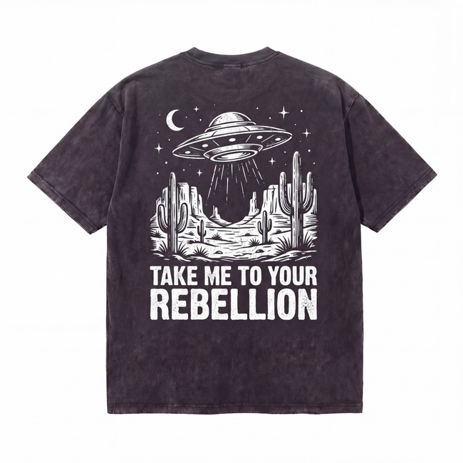 Black t-shirt with UFO desert graphic and 'Take Me To Your Rebellion' text print. Hover Image